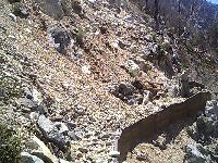 Wall under rockslide