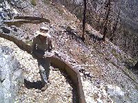 Lou carries rocks
