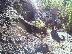 Tom removes mud slice